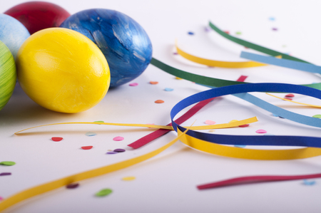 Colorful eggs and colored paperの写真素材