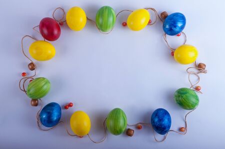 Easter frame from multi-colored eggsの写真素材