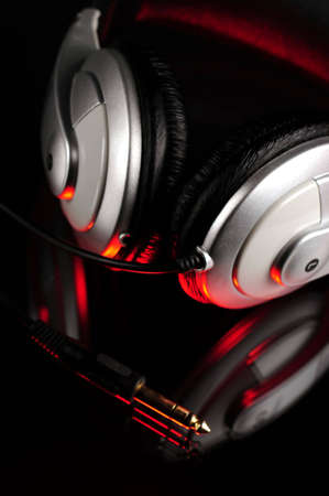 Headphones and compact disk with reflection