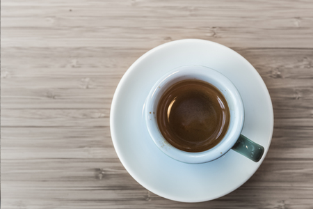 Espresso coffee cup. fresh morning coffee on the wooden table top views concept.の写真素材