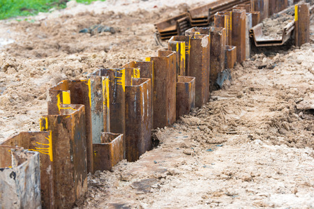 Retaining wall steel sheet pile driving machine workの写真素材