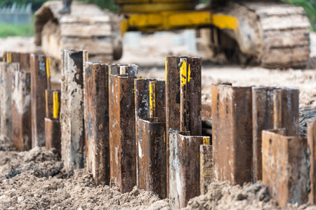 Retaining wall steel sheet pile driving machine workの写真素材