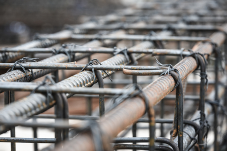 Using steel wire for securing steel bars with wire rod for reinforcement of concrete or cement. focus to steel wireの写真素材