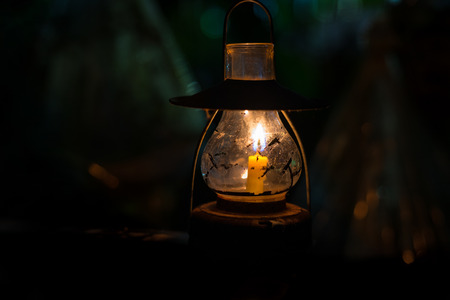 Candle lamp burning with a soft glow light