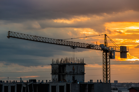 Over view of tower crane in construction machine a sky background, especially in dim light.の写真素材