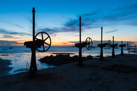 Industrial valve /Steel flanged valves on beachの写真素材