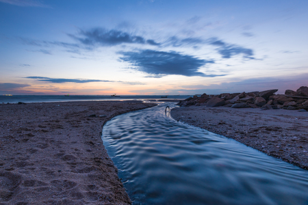 Drainage to sea on the beach. Ditch to seaの写真素材