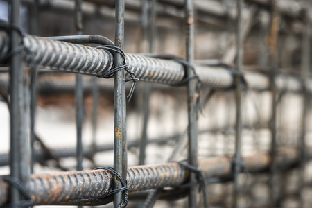 Using steel wire for securing steel bars with wire rod for reinforcement of concrete or cement. focus to steel wireの写真素材