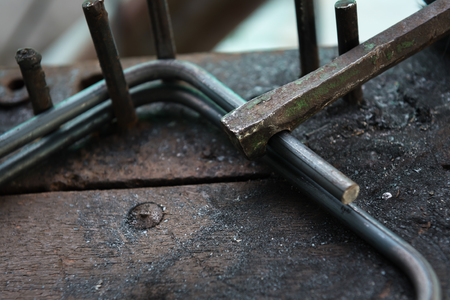 Steel bar bending on tableの写真素材