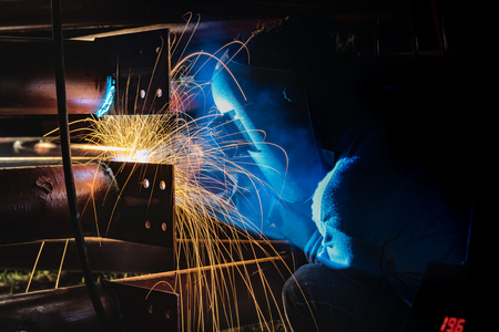 Welding or steel fabrication in construction industry work.