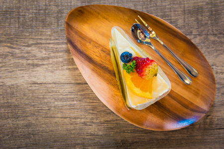 Bakery fruit cake fresh morning on the wooden table in the bakery cafeの写真素材