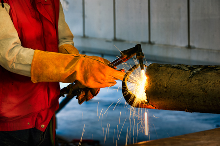Worker to cutting steel in workshop of construction site with Oxy-Propane cutting and welding to...