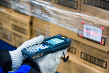 barcode scanner checking goods in the cold room or warehouse