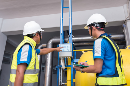 Engineers training in the machine room at factory workplace for production process. Selection focus people learning.の写真素材