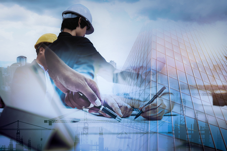 Civil Engineer Jobs, Double exposure of Project Management Team and Construction Site with tower crane background, Engineer Designer Consultant and Architecture Team concept.の写真素材
