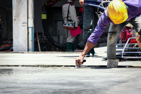 Construction labor, Plasterer concrete cement work. using a trowel to smooth or leveling concrete...