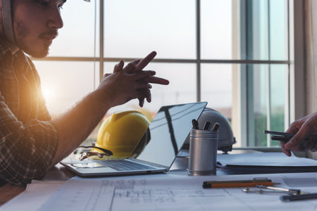 Engineer meeting in modern office with Architecture Interior Designer. Discussion of architectural project and Construction.の写真素材