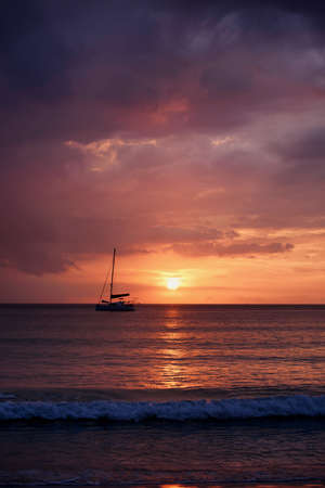 Silhouette of a luxurious yacht on the sea at sunset in Thailand