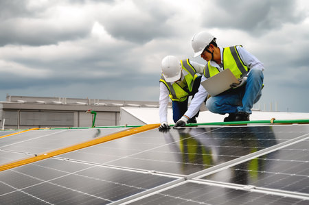 Young Engineers and Technicians Discuss and Check Quality of Installing Solar Photovoltaic Panels...
