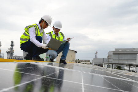 Young Engineers and Technicians Discuss and Check Quality of Installing Solar Photovoltaic Panels...