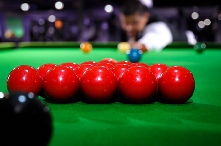 Snooker red ball group set with snooker player blur in background while aiming red ball on snooker table.の写真素材