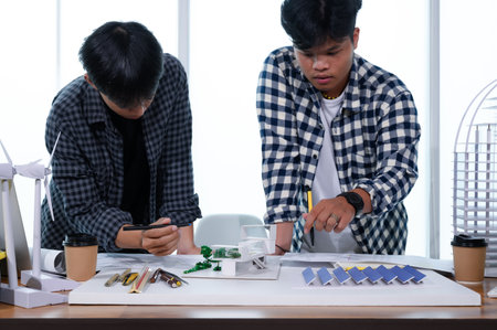 Asian Architect Students Studying Modern House Design and Finding Ways to Utilize Natural...