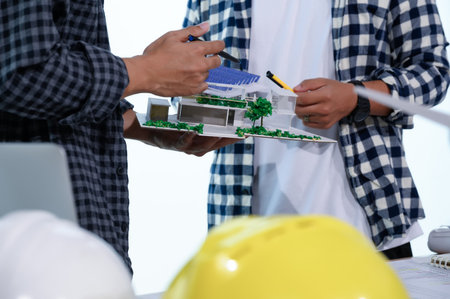 Asian Architect Students Studying Modern House Design and Finding Ways to Utilize Natural...