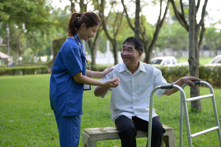 Asian Female Doctor Help Support the Elderly and Provide Encouragement During Treatment....
