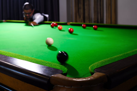 Snooker players play the game of snooker.