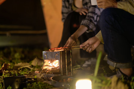 Close-up of barbecue meal grill in the wilderness of backpacker group. Grilled meals ready to eat...