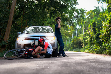Calls for Immediate Assistance after Young Asian man driving a car crashes into a cyclist falls and...