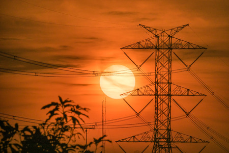 High voltage transmission lines. High voltage tower background at sunset