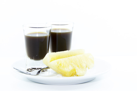 Healthy snack serve with espresso and pineapple on white backgroundの写真素材