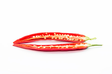 Section of red chili pepper with seed on white backgroundの写真素材