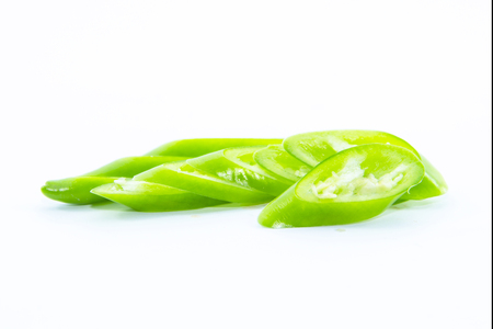 Sliced of green chili pepper on white backgroundの写真素材