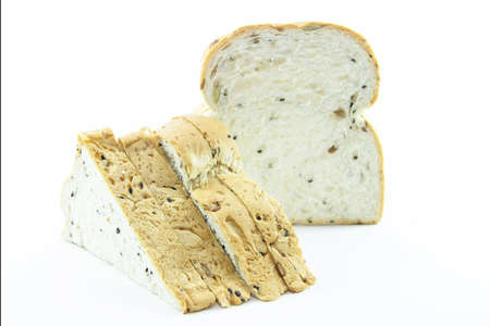 Whole grain bread sliced for sandwich with raw on white background
