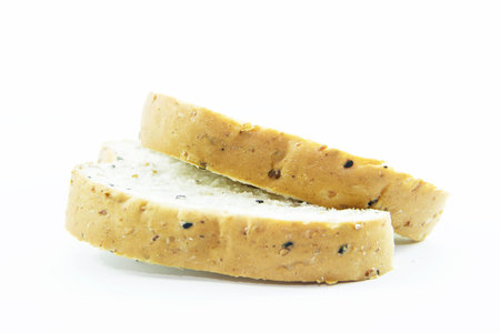 Cutting healthy bread with sesame on white background