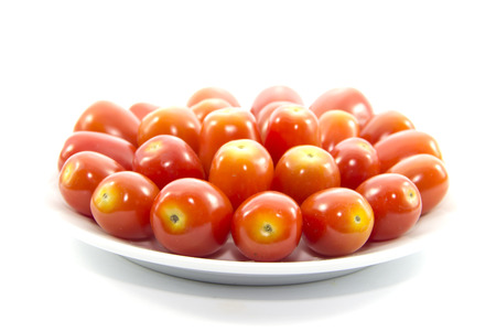 Ingredient fresh tomato size on white plateの写真素材