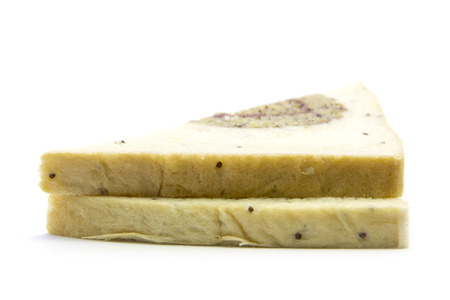 Sandwich sliced whole wheat bread with banana gold edge on white background