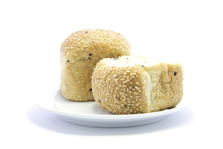 Whole grain healthy bread recipe on white plate and white backgroundの写真素材