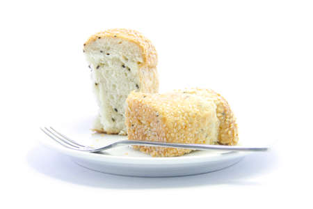 Whole grain half sliced bread food on white plate and white backgroundの写真素材