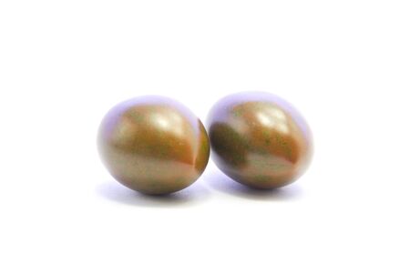 Black tomatoes ingredient on bottom view on white backgroundの写真素材