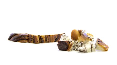 Bread with chocolate edge cut small piece on white backgroundの写真素材