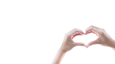 Hand woman perfect heart shape on white backgroundの写真素材