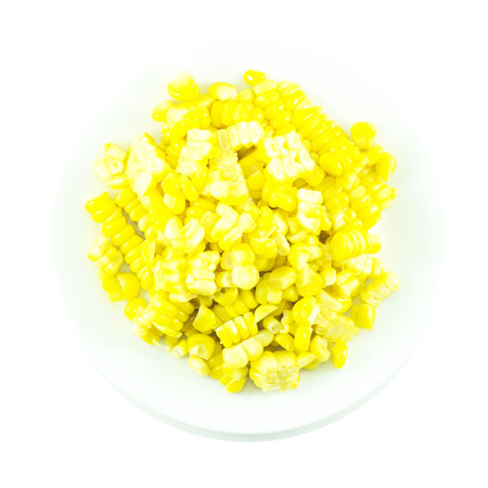 Sweet yellow corn boiled and sliced on white backgroundの写真素材