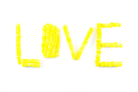 Love sweet yellow corn abstract arrange on white backgroundの写真素材