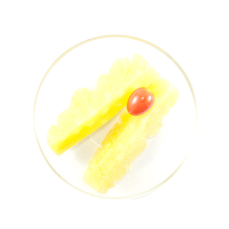 Pineapple and tomato contrast color on white backgroundの写真素材