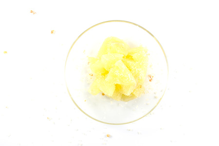 Pineapple with sugar mix dipping on white backgroundの写真素材