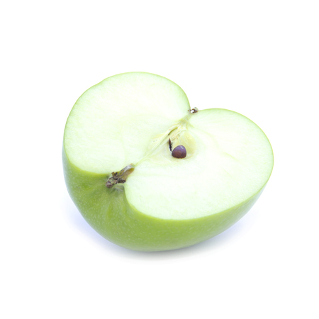 Side view green apple half sliced on white backgroundの写真素材