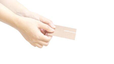 Give business card with two hand metaphor with respect on white backgroundの写真素材
